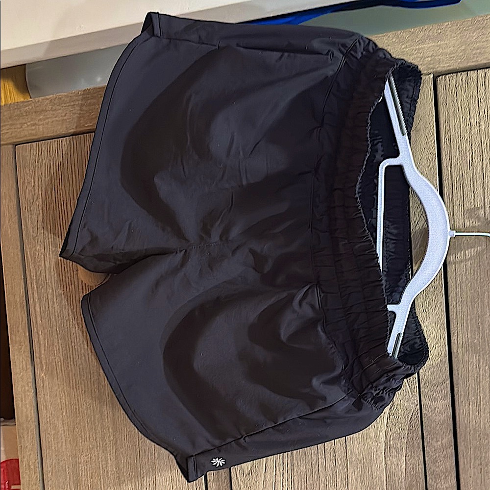 Athleta Girl: run free 2.5” short black. XXL/16; built in pockets. 86% polyester